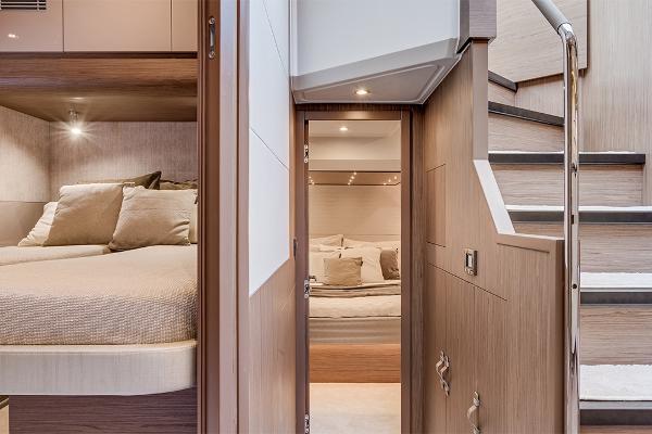 Slide: The Image of Interior of 2021 Beneteau Gran Turismo 50 Sportfly yacht, featuring cozy bedrooms and modern staircase. - 26