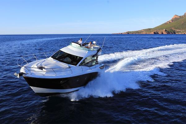 Slide: The Image of 2021 Beneteau Gran Turismo 50 Sportfly cruising on open water. - 6