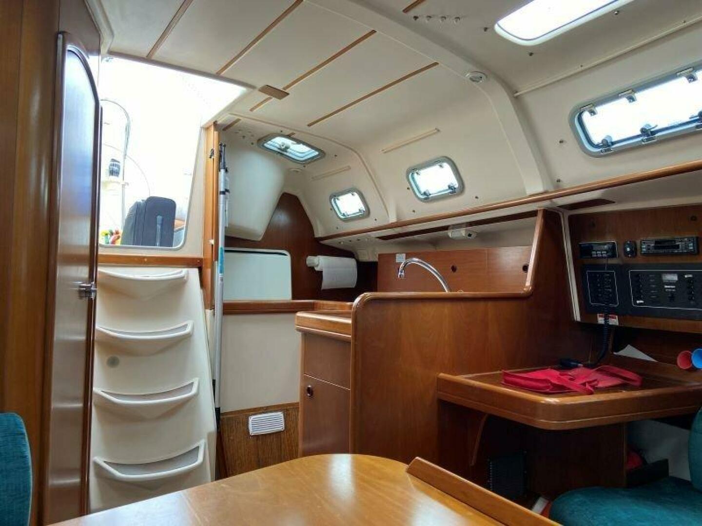 Slide: The Image of 1999 Beneteau Oceanis 321   Navigation Station And Galley - 5179588