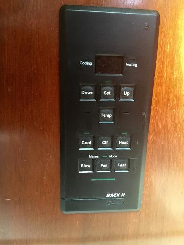 Slide: The Image of Control panel on Beneteau Oceanis 321 yacht, 2000 model, featuring temperature and fan settings. - 26