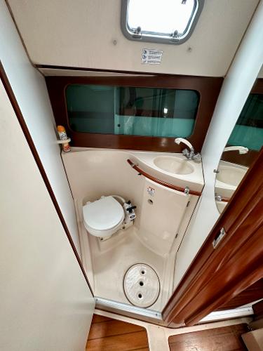 Slide: The Image of Beneteau Oceanis 321 yacht bathroom, compact design with toilet and sink, 2000 model. - 27