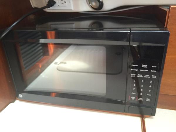 Slide: The Image of Microwave inside a 2000 Beneteau Oceanis 321 yacht kitchen area. - 29