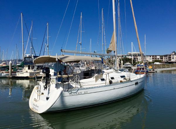 Slide: The Image of Beneteau Oceanis 321 sailboat docked in marina, 2000 model, clear blue sky. - 3