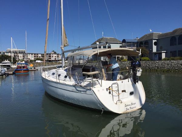 Slide: The Image of Beneteau Oceanis 321 sailboat docked in marina, 2000 model, sunny day. - 4