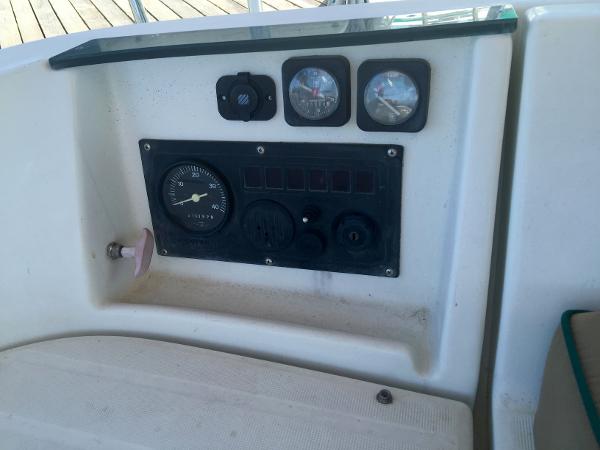 Slide: The Image of Control panel of a 2000 Beneteau Oceanis 321 sailboat, featuring gauges and switches. - 40