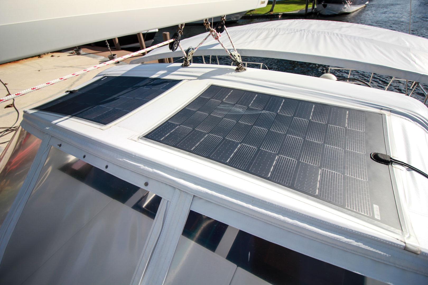 Slide: The Image of Solar panels on the deck of a 2015 Beneteau Sense 55 sailboat. - 13