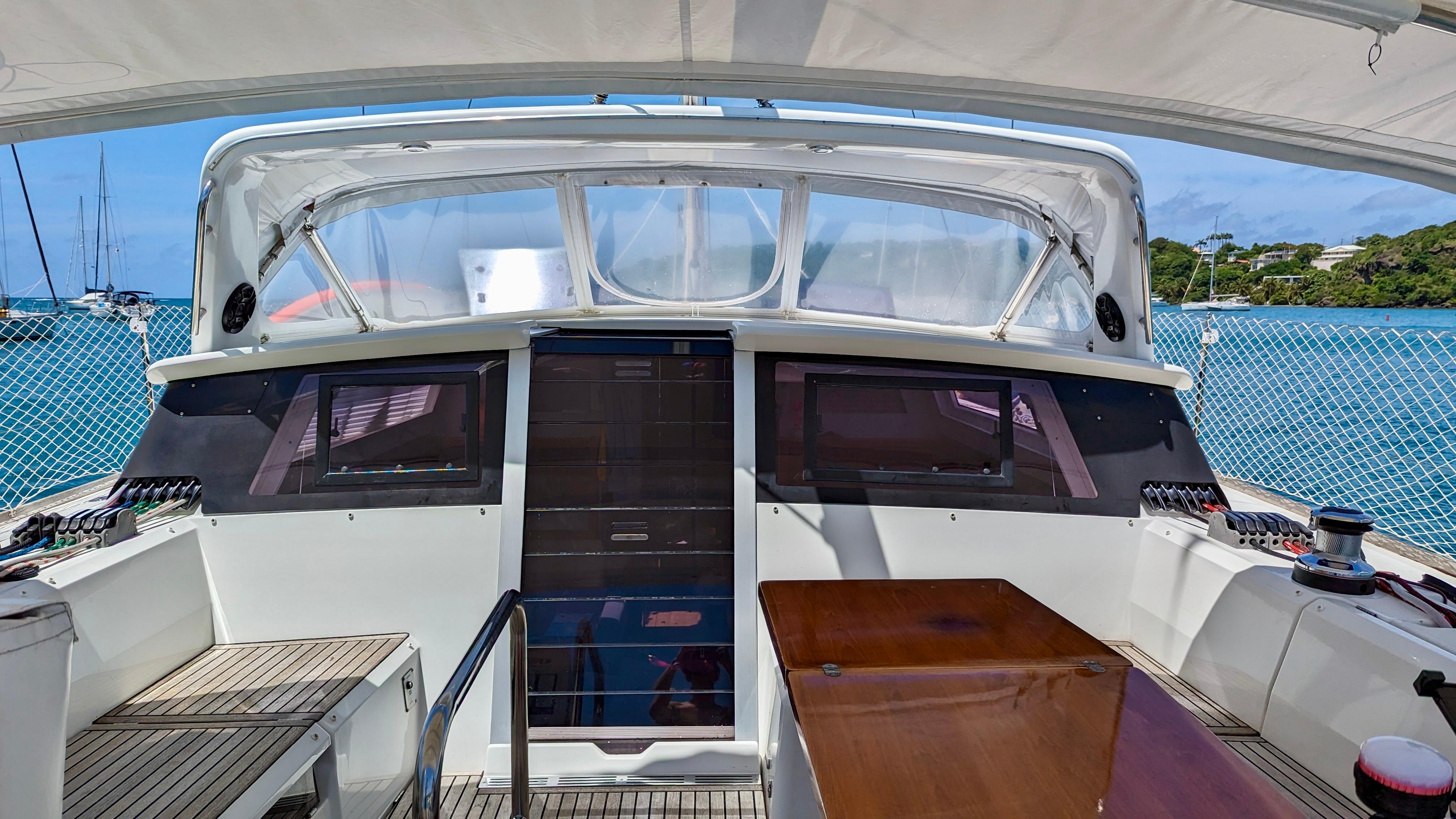 Slide: The Image of Cockpit view of 2015 Beneteau Sense 55 yacht with ocean backdrop. - 17