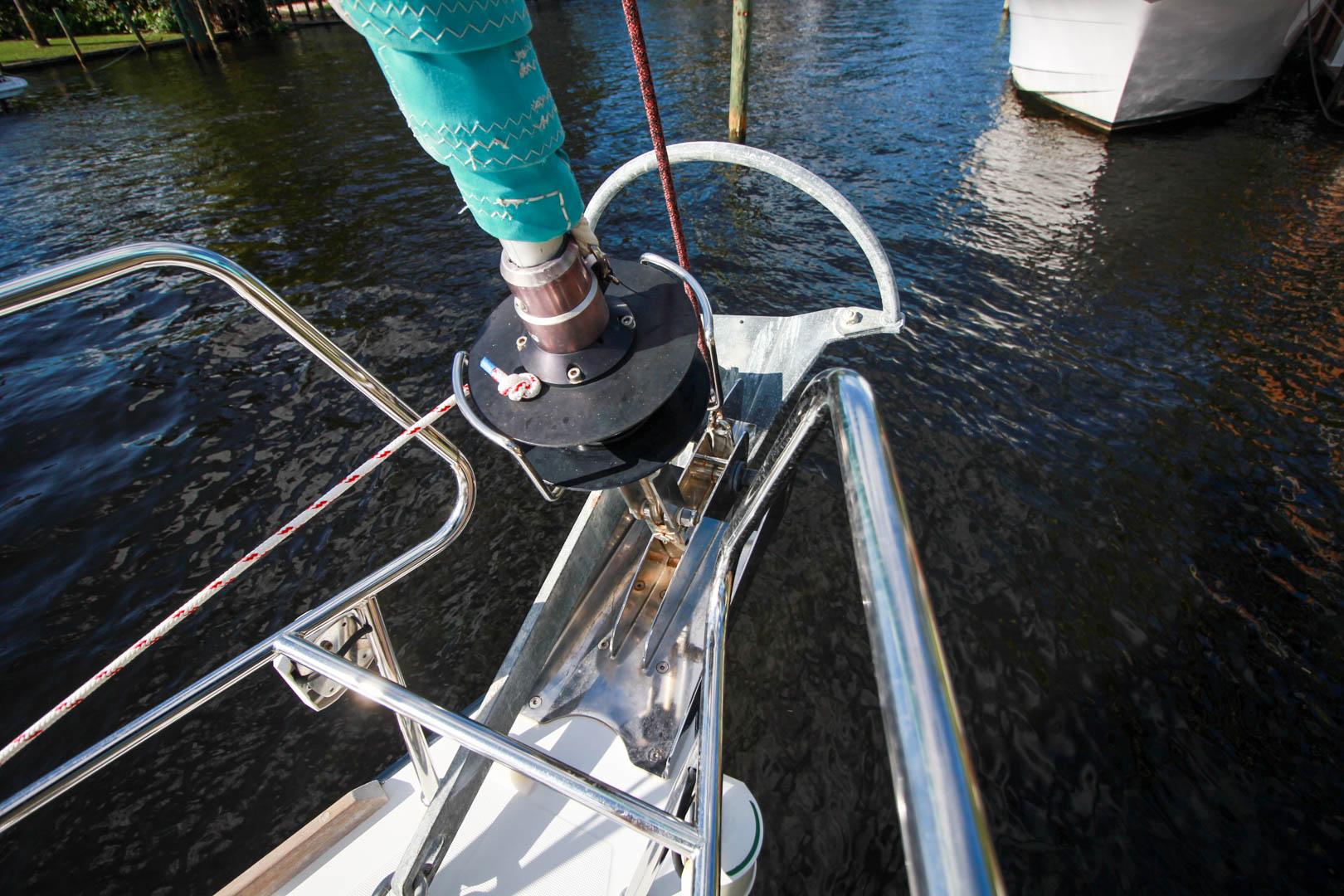 Slide: The Image of Bow of 2015 Beneteau Sense 55 sailboat with anchor and rigging. - 21