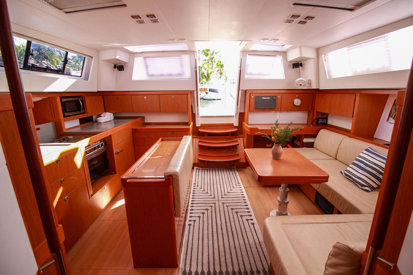 Slide: The Image of Luxurious interior of 2015 Beneteau Sense 55 yacht with modern kitchen and cozy seating area. - 39
