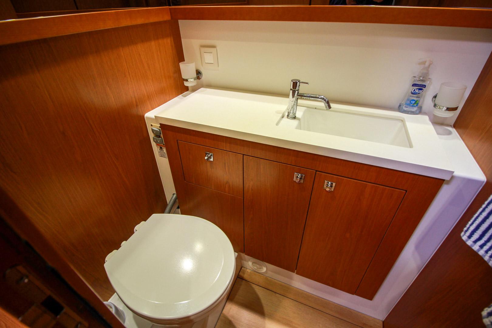 Slide: The Image of Compact bathroom in 2015 Beneteau Sense 55 yacht with sink and toilet. - 41