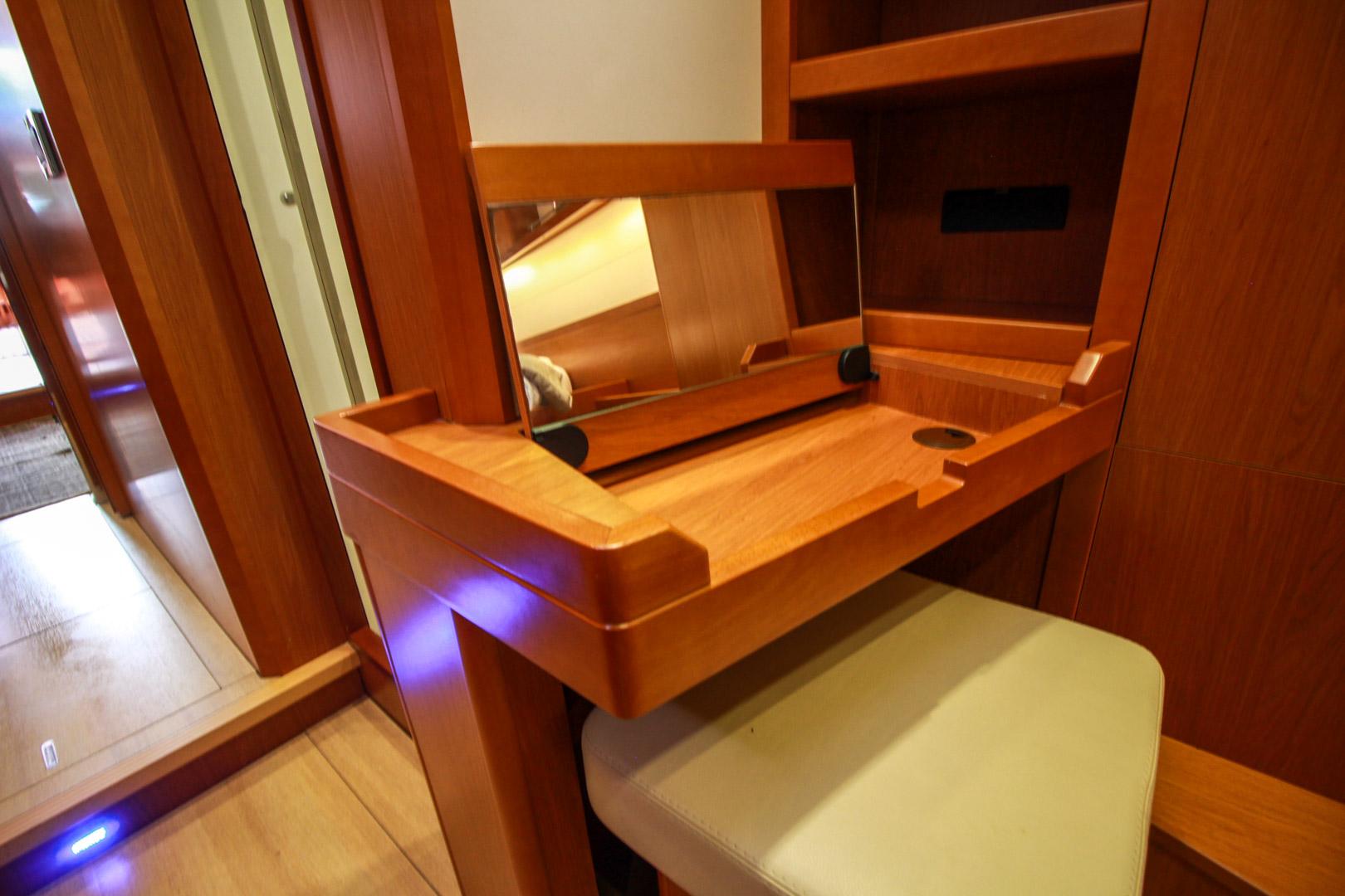 Slide: The Image of Vanity area with mirror and stool in 2015 Beneteau Sense 55 yacht interior. - 48