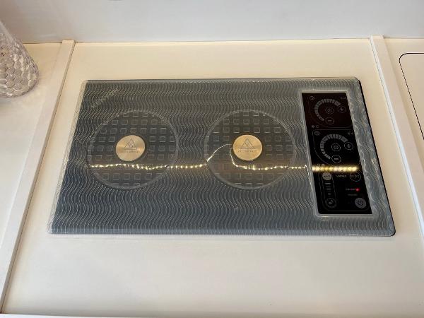 Slide: The Image of Induction cooktop on 2021 Beneteau Swift Trawler 41 yacht kitchen. - 13