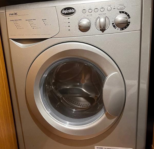 Slide: The Image of Splendide washing machine inside a 2021 Beneteau Swift Trawler 41 yacht. - 31