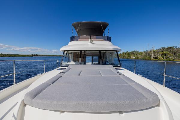 Slide: The Image of 2021 Beneteau Swift Trawler 41 on water, featuring spacious deck and sleek design. - 37