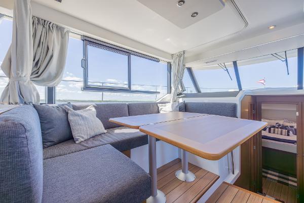 Slide: The Image of Interior of 2021 Beneteau Swift Trawler 41 with modern seating and dining area. - 6