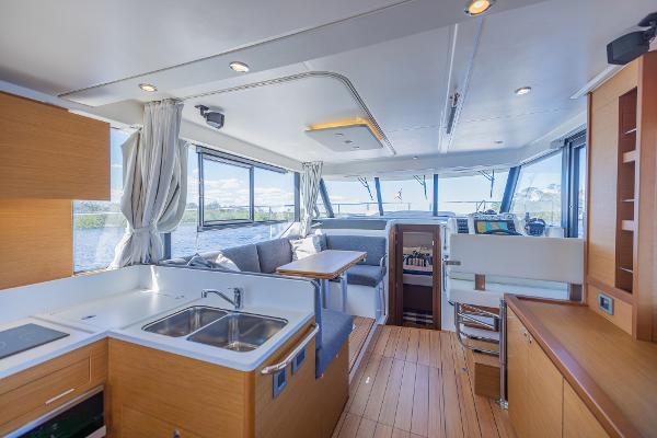 Slide: The Image of Interior of 2021 Beneteau Swift Trawler 41, featuring modern kitchen and spacious seating area. - 8