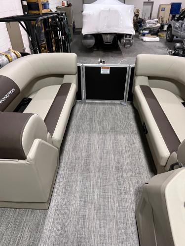 Slide: The Image of 2025 Bennington 188 SL pontoon boat interior with beige and brown seating. - 5