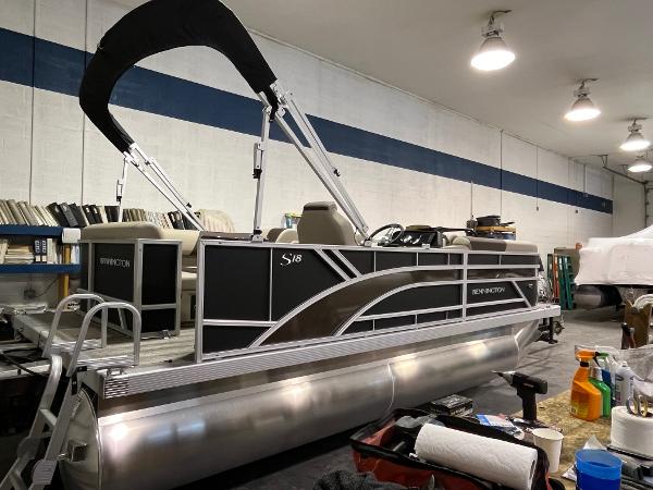 Slide: The Image of 2025 Bennington 188 SL pontoon boat in a workshop setting. - 6