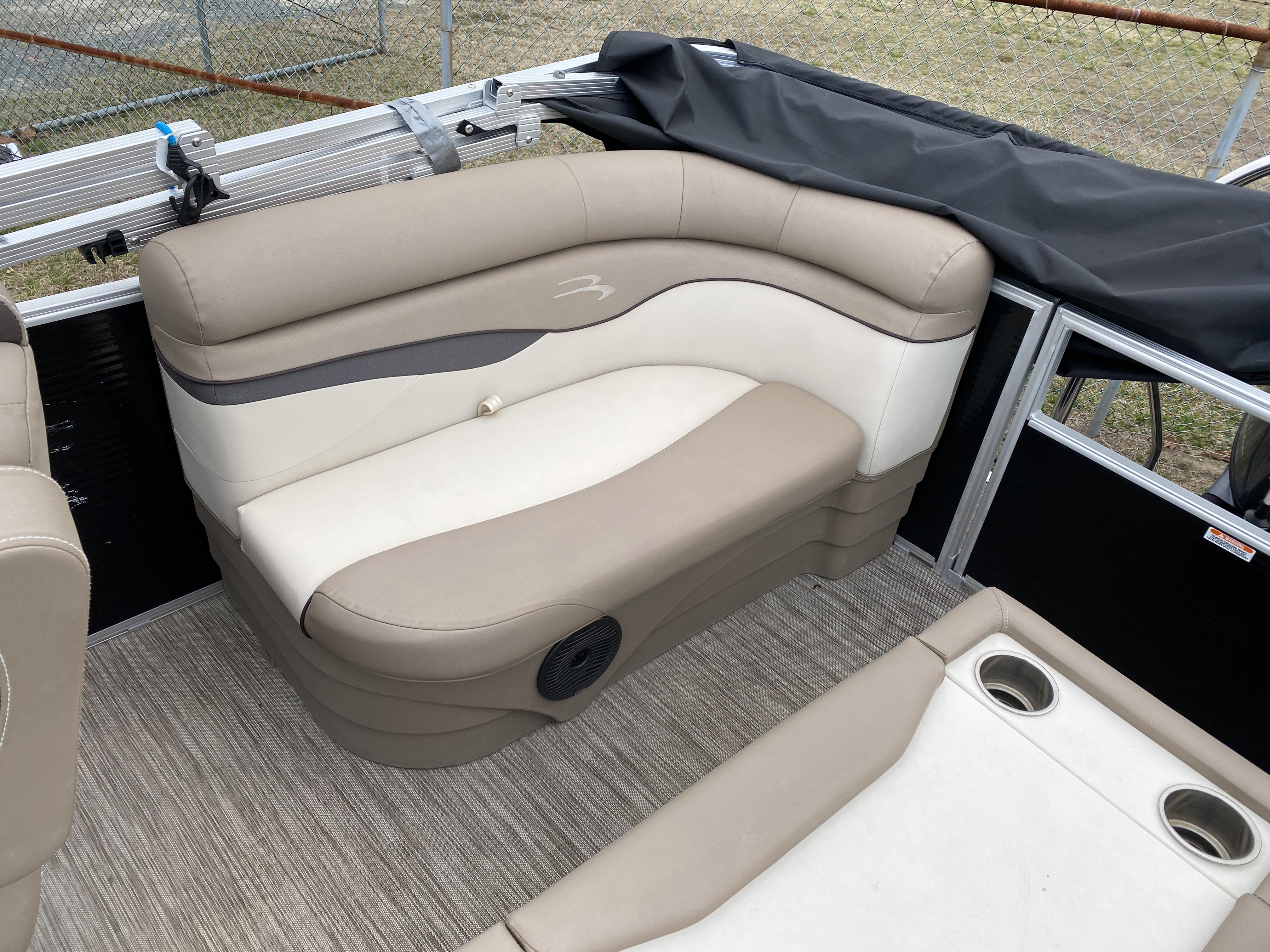 Slide: The Image of 2021 Bennington 20 SSR boat interior with beige and cream seating. - 7