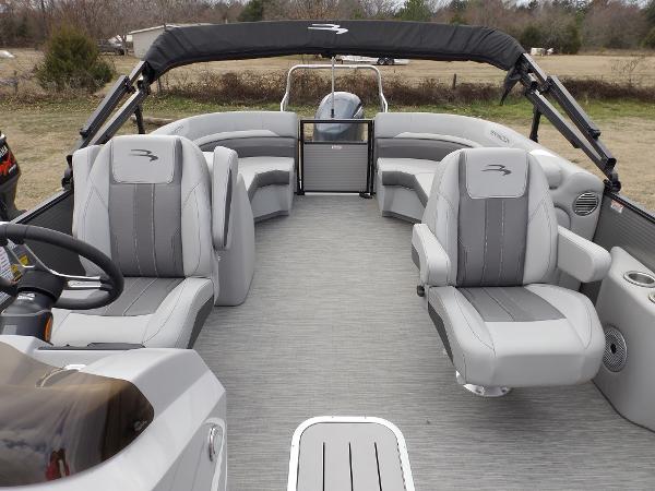 Slide: The Image of 2023 Bennington 22 SXSR pontoon boat interior with gray seating and helm. - 11