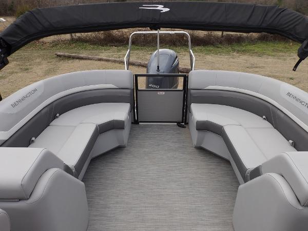 Slide: The Image of 2023 Bennington 22 SXSR pontoon boat with spacious seating and modern design. - 12