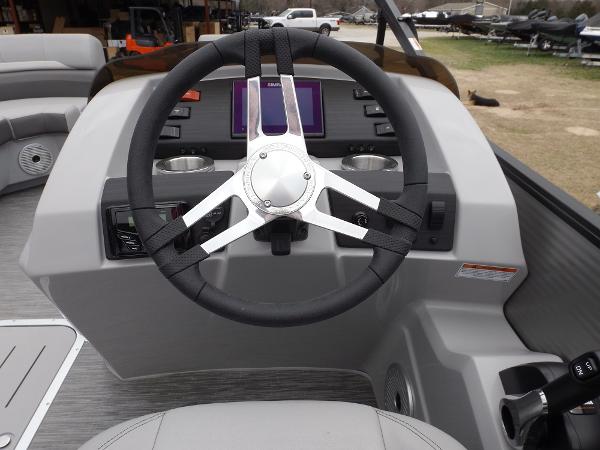 Slide: The Image of 2023 Bennington 22 SXSR boat steering console with modern controls and displays. - 15