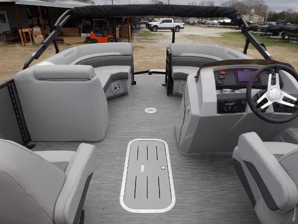 Slide: The Image of 2023 Bennington 22 SXSR pontoon boat interior with gray seating and modern dashboard. - 16