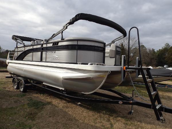 Slide: The Image of 2023 Bennington 22 SXSR pontoon boat on a trailer, side view. - 2