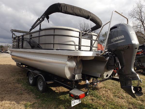 Slide: The Image of 2023 Bennington 22 SXSR pontoon boat with Yamaha outboard motor on trailer. - 6