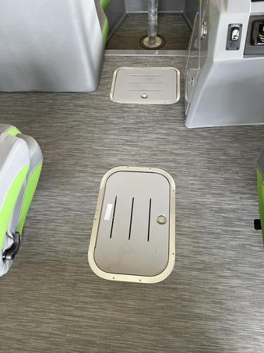 Slide: The Image of 2023 Bennington 23LTSB boat interior with storage compartments and seating. - 4