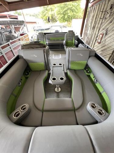 Slide: The Image of 2023 Bennington 23LTSB pontoon boat interior with gray and green seating. - 7