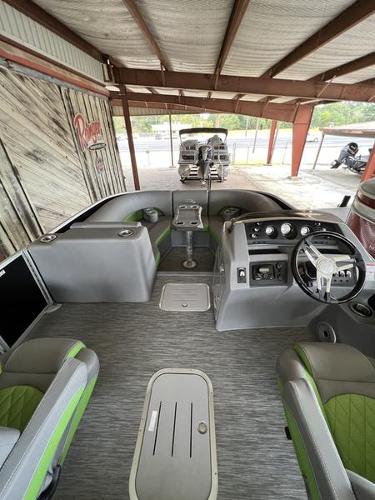 Slide: The Image of 2023 Bennington 23LTSB pontoon boat interior with modern seating and steering console. - 8