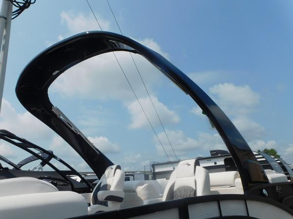 Slide: The Image of 2024 Bennington 23 RFBA pontoon boat with sleek black arch and white seating. - 16