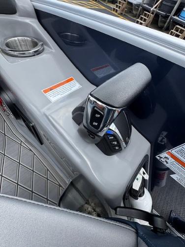 Slide: The Image of 2023 Bennington 25 QSBA boat control panel with throttle and cup holder. - 10