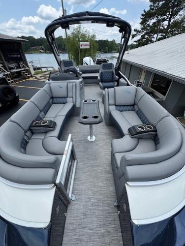 Slide: The Image of 2023 Bennington 25 QSBA pontoon boat with spacious seating and modern design. - 3