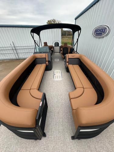 Slide: The Image of 2025 Bennington M26 pontoon boat with tan seating and black canopy. - 4