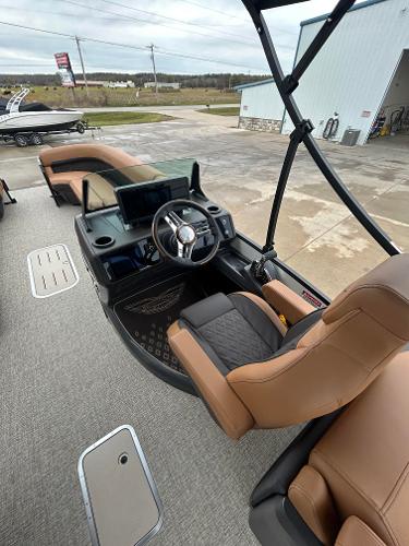 Slide: The Image of 2025 Bennington M26 boat interior with modern helm and tan seating. - 6