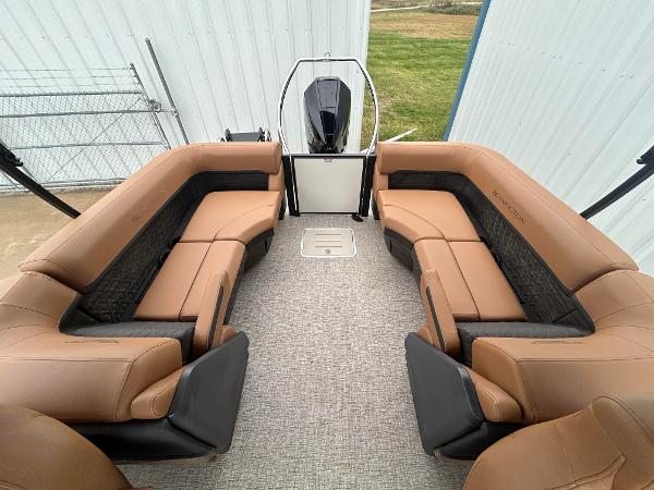 Slide: The Image of 2025 Bennington M26 boat interior with tan seating and modern design. - 8