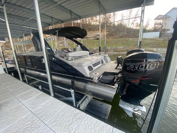 Slide: The Image of 2020 Bennington 30 QSBAX2 pontoon boat docked with Mercury 400 outboard engine. - 14