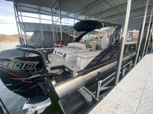 Slide: The Image of 2020 Bennington 30 QSBAX2 pontoon boat with Mercury Racing 400 engine docked under cover. - 17