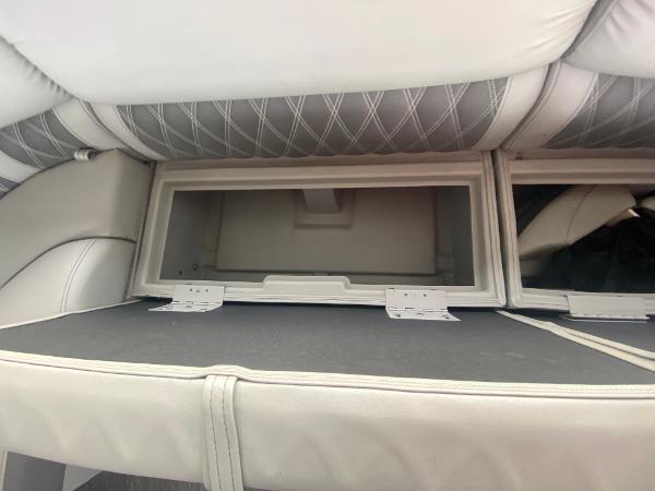 Slide: The Image of Storage compartment in 2020 Bennington 30 QSBAX2 boat with cushioned seating. - 32
