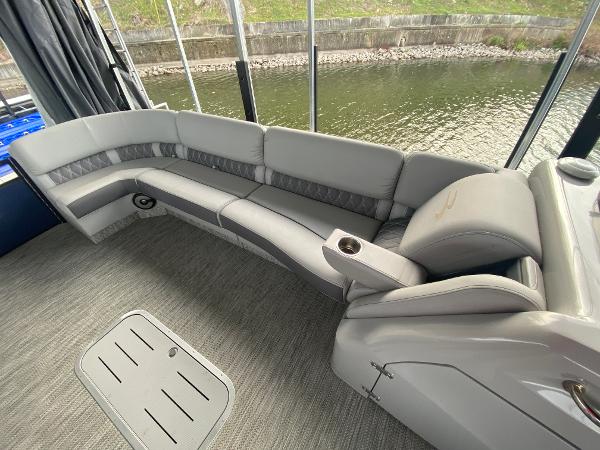 Slide: The Image of Luxurious seating on 2020 Bennington 30 QSBAX2 pontoon boat, overlooking serene water. - 45