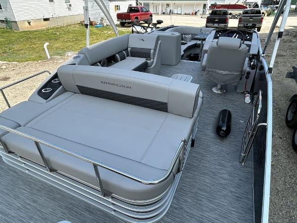 Slide: The Image of 2022 Bennington L25 pontoon boat with spacious seating and modern design. - 2