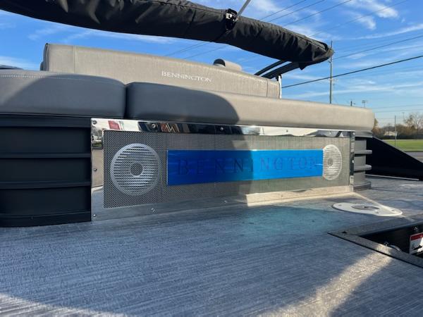 Slide: The Image of 2023 Bennington LX Sport Line boat with premium seating and built-in speakers. - 6
