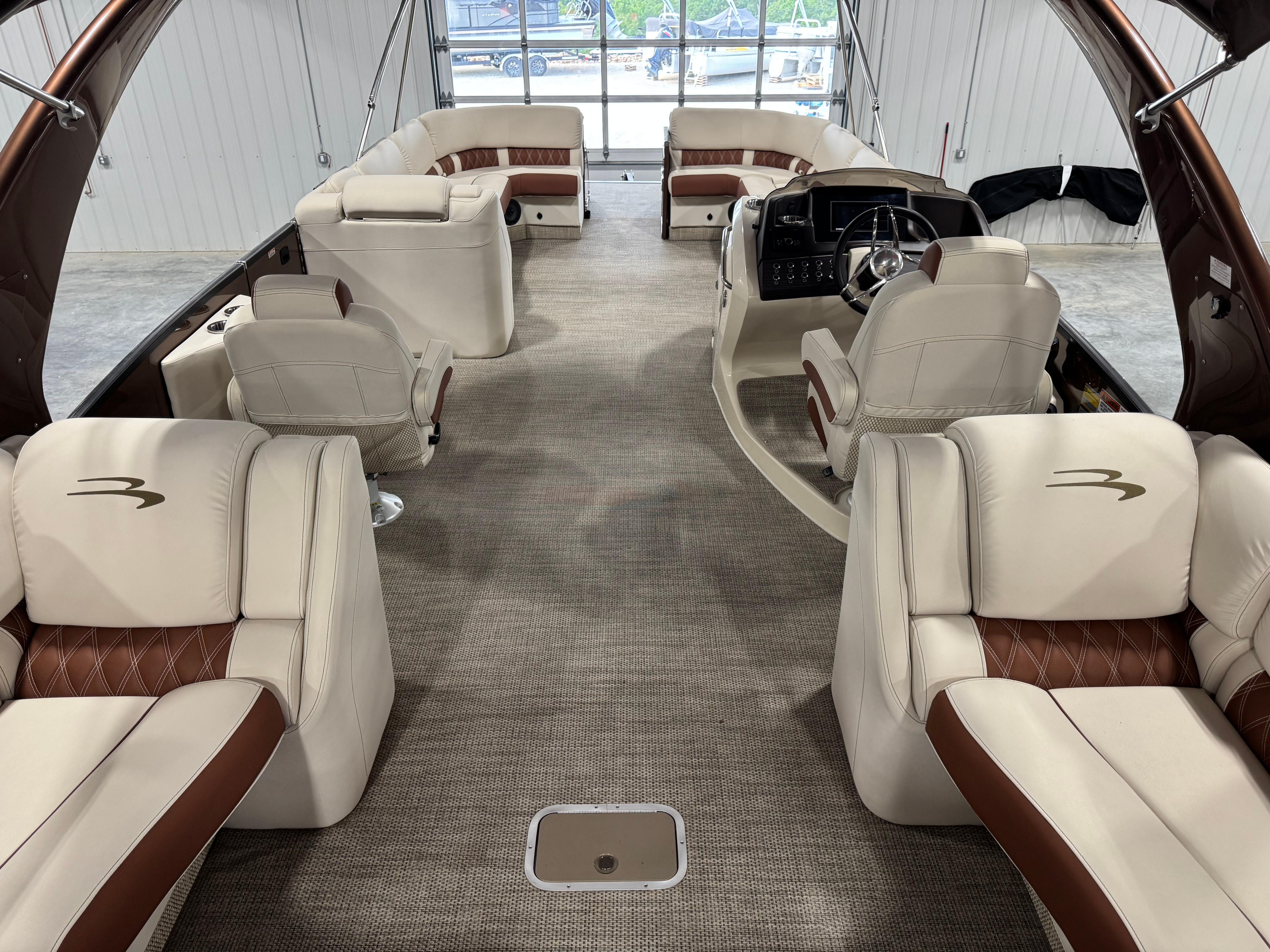 Slide: The Image of Luxurious interior of 2022 Bennington QX 30 pontoon boat with plush seating and modern design. - 7