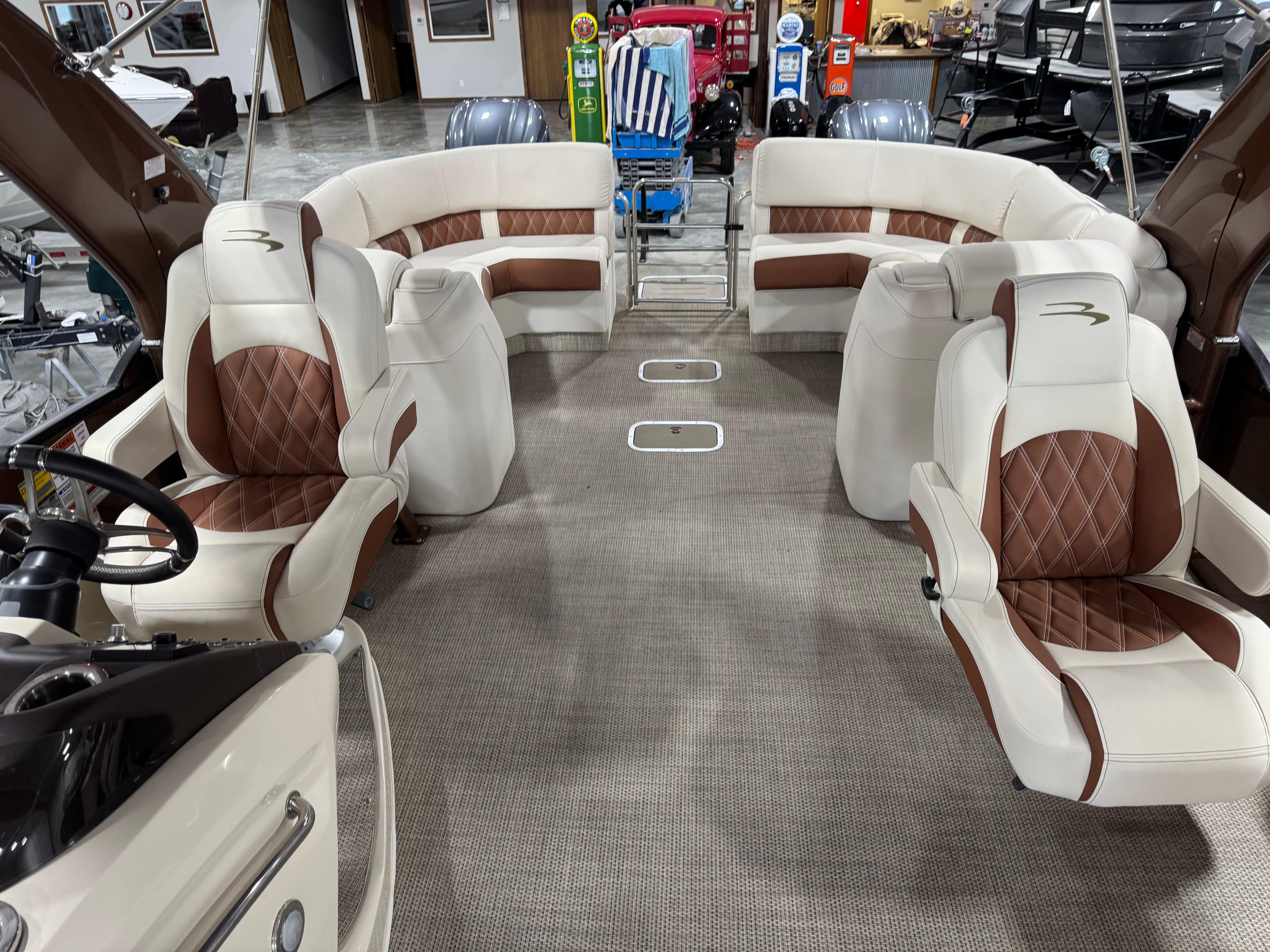 Slide: The Image of 2022 Bennington QX 30 boat interior with luxurious seating and modern design. - 9