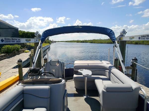 Slide: The Image of 2020 Bennington SV 20 SLV pontoon boat docked on a sunny day. - 11