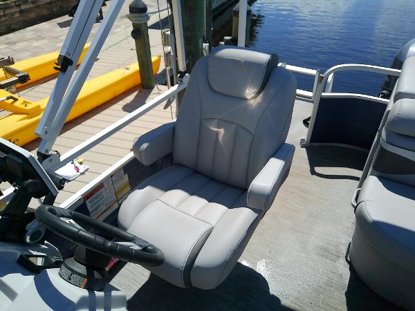 Slide: The Image of 2020 Bennington SV 20 SLV boat interior with captain's chair and steering wheel. - 19