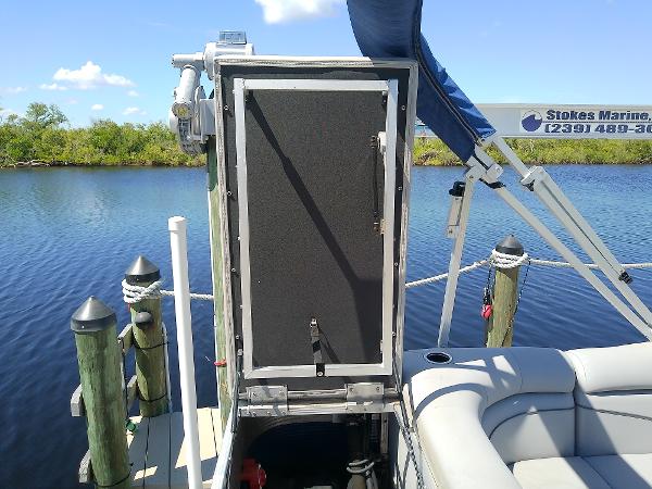 Slide: The Image of 2020 Bennington SV 20 SLV pontoon boat docked by a serene lake. - 28