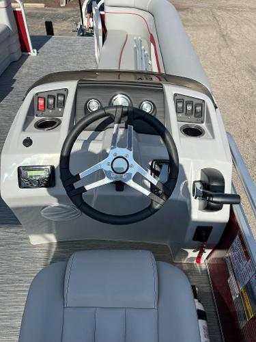 Slide: The Image of 2023 Bennington SV Line boat dashboard with steering wheel and control panel. - 5